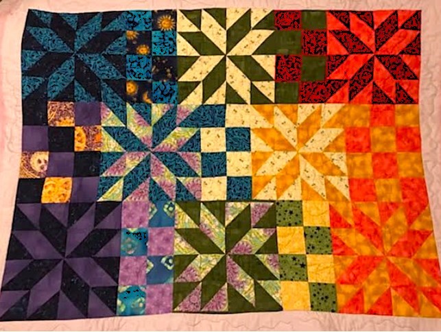 Gorgeous 7 chakras quilt handmade by Ginger Hughes for the Nelson Psychic & Wellness Fair raffle